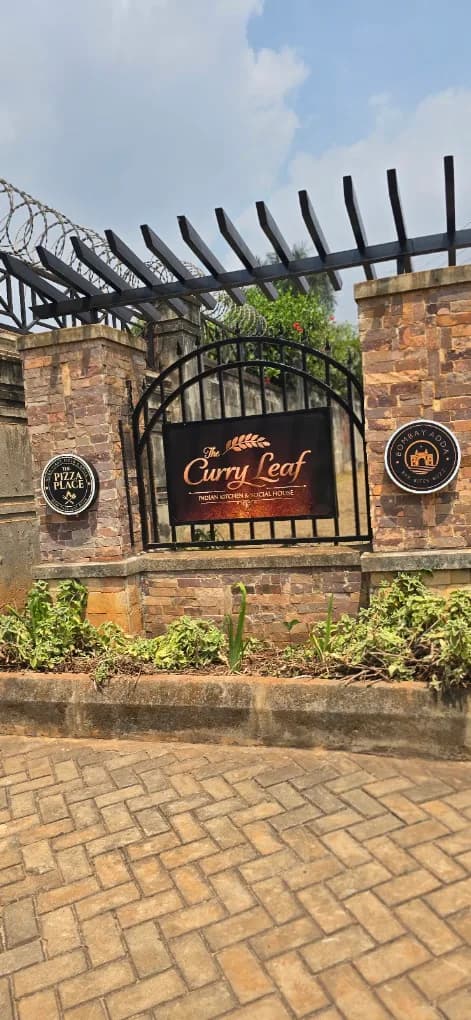 The Curry Leaf entrance sign in Lubowa