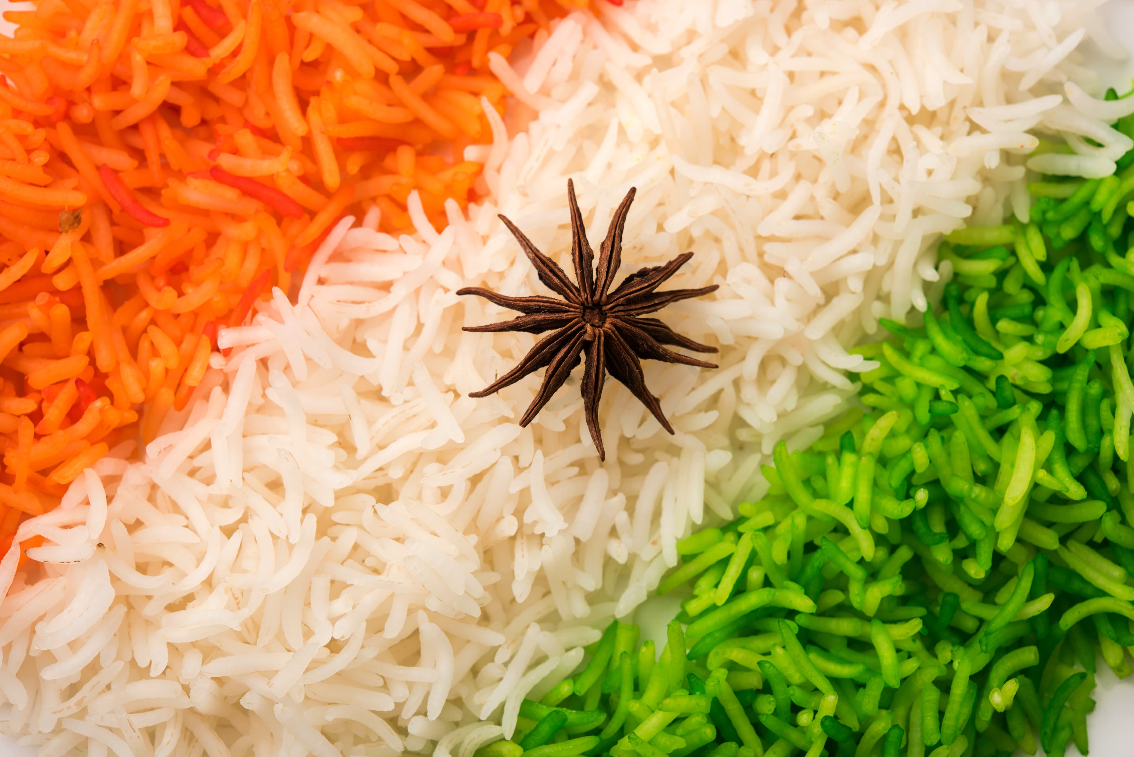 Rice in the colours of the Indian flag with a star anise at its centre